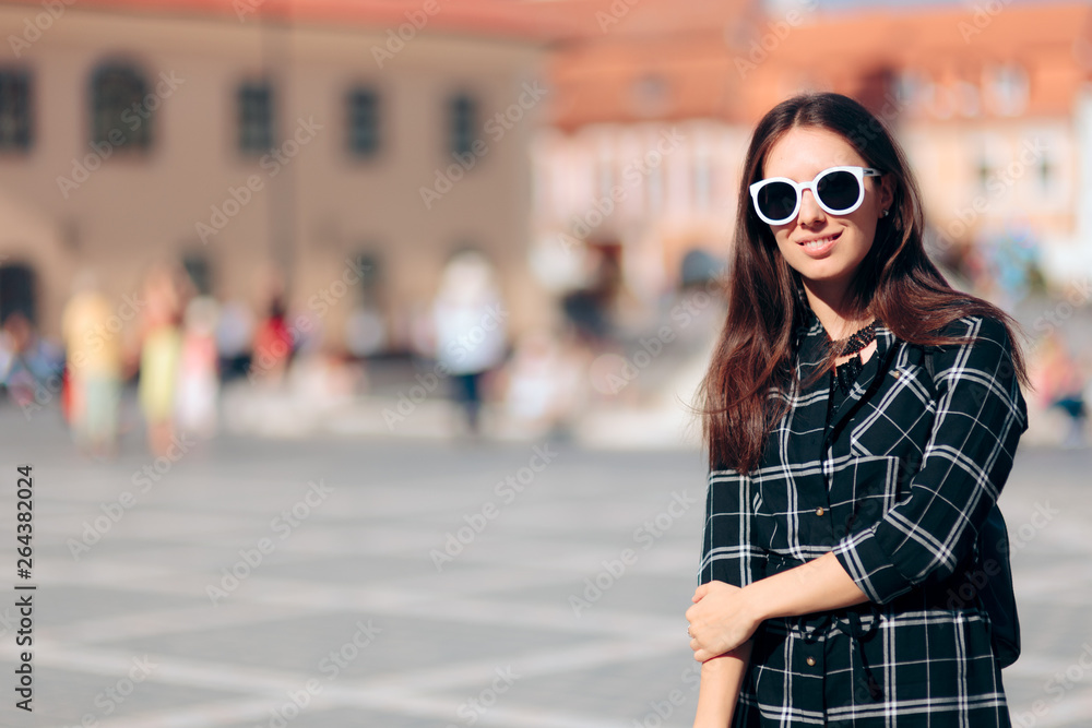 Fototapeta premium Portrait of a Young Woman Visiting Historic Town
