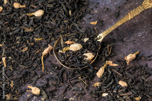 Wallpaper Mural Loose Black Tea with Jasmine Flowers on dark background. Torontodigital.ca