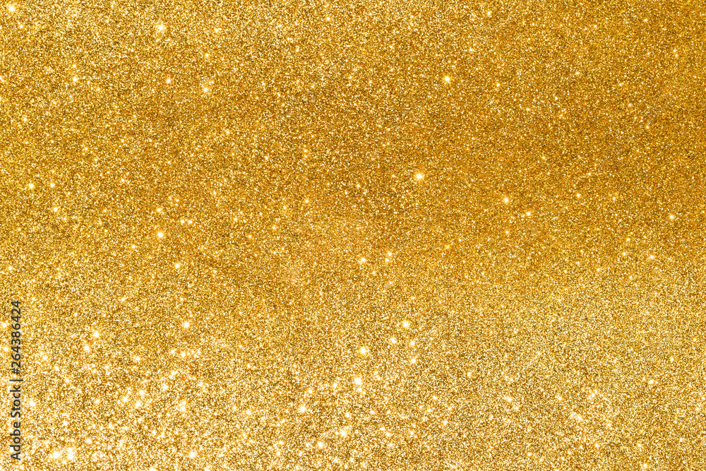 sparkles of golden glitter abstract background