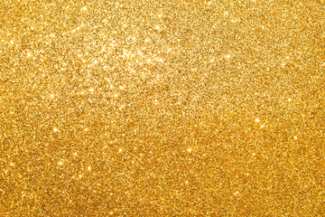 sparkles of golden glitter abstract background