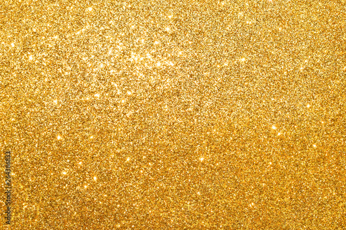 sparkles of golden glitter abstract background