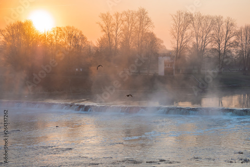 View of the Rumba Falls in the city of Kuldiga, Latvia. Early spring morning. 