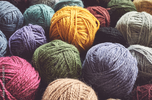 Fototapeta Vintage toned picture of wool yarn balls, shallow depth of field.