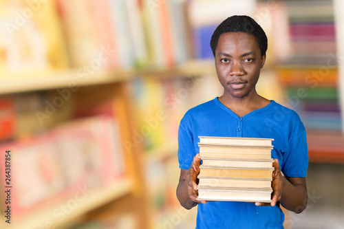 Handsome African American man with books