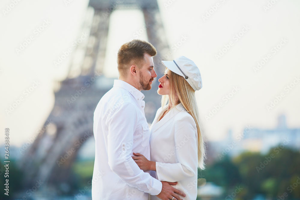 Romantic couple having a date near the Eiffel tower Romantic couple having a date near the Eiffel tower