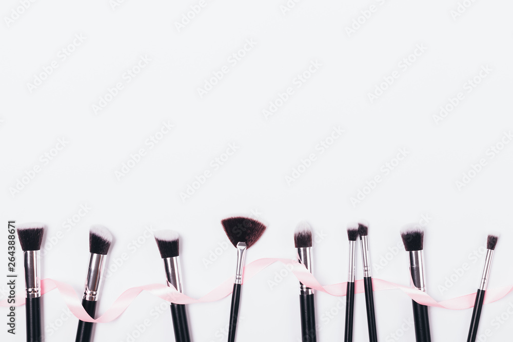 Top view row of professional makeup brushes Top view row of professional makeup brushes