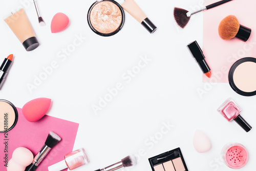 Flat lay makeup background frame of professional cosmetic