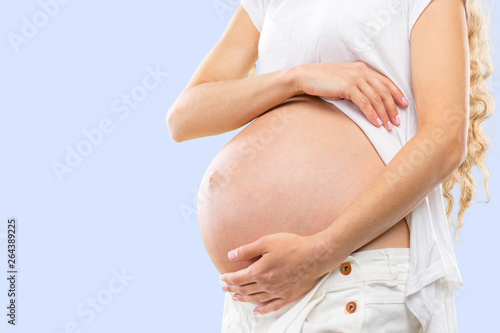 Portrait of the young happy smiling pregnant woman