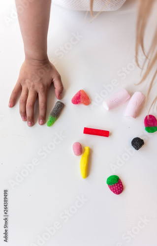 Children eating candy at the dining table
