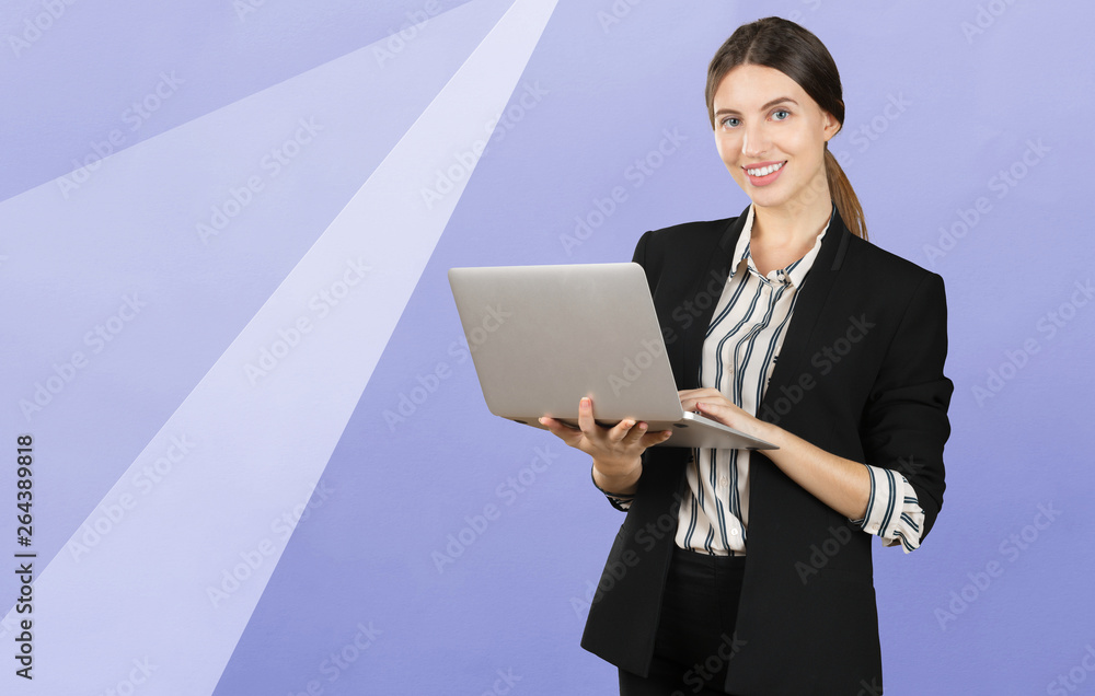Portrait of a young business woman using laptop Portrait of a young business woman using laptop