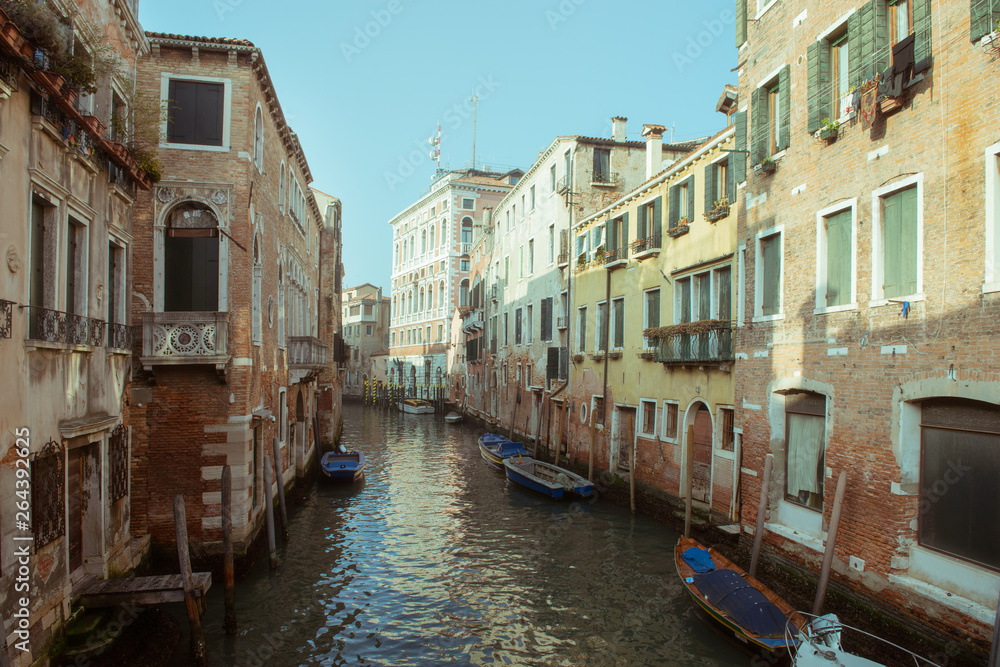 Сhannel with boats in Venice, Italy. Beautiful romantic italian city.