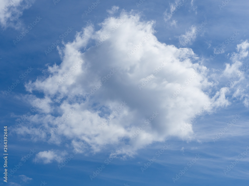 Blue sky on a sunny day with fluffy white and blue clouds. Blue sky on a sunny day with fluffy white and blue clouds.
