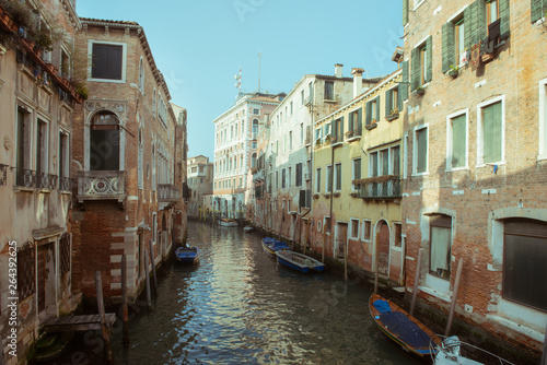 Сhannel with boats in Venice, Italy. Beautiful romantic italian city. © Khorzhevska