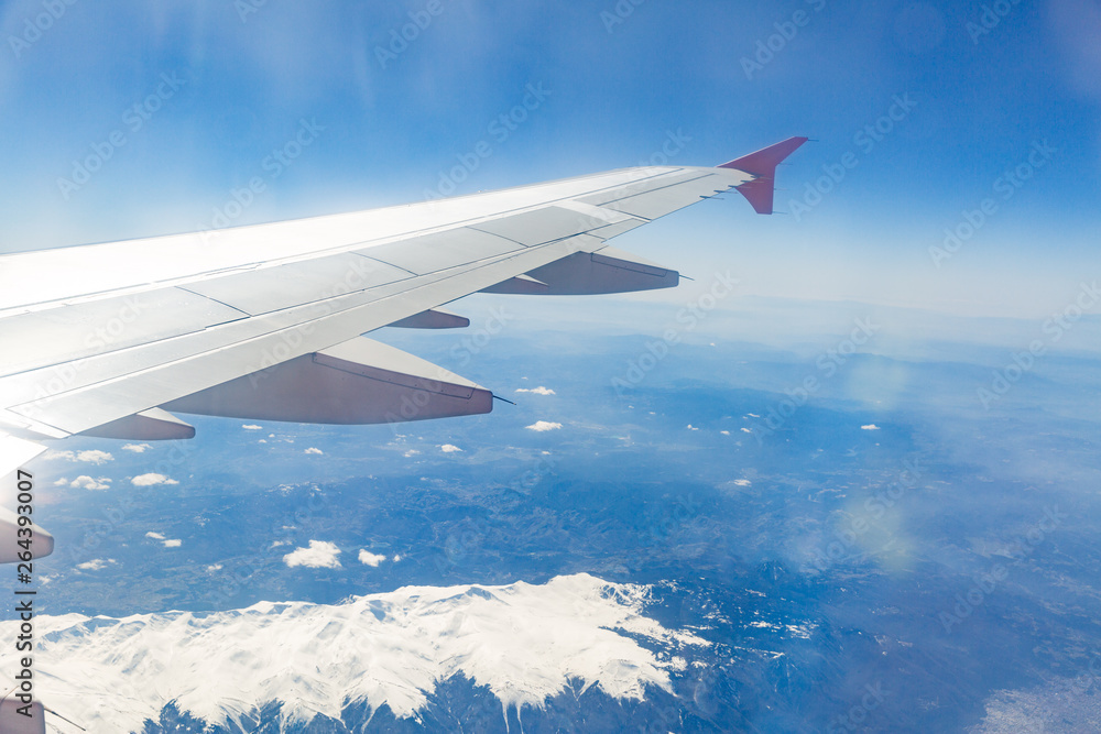 view from the window of the plane that flies over the mountains view from the window of the plane that flies over the mountains