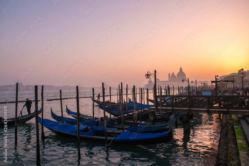 Grand Сhannel with gondolas at sunset, Venice, Italy. Beautiful ancient romantic italian city.