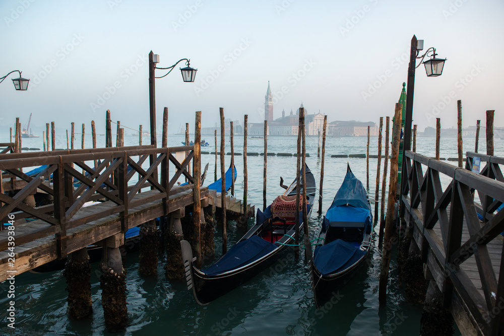 Grand Сhannel with gondola and gondolier, Venice, Italy. Beautiful ancient romantic italian city.