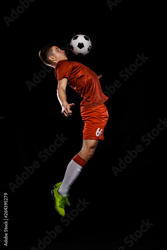 Teenager - soccer player. Boy in football sportswear after game with ball. Sport concept. © Mike Orlov