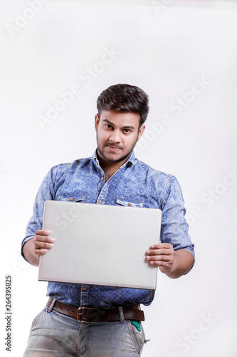  Young indian man with laptop