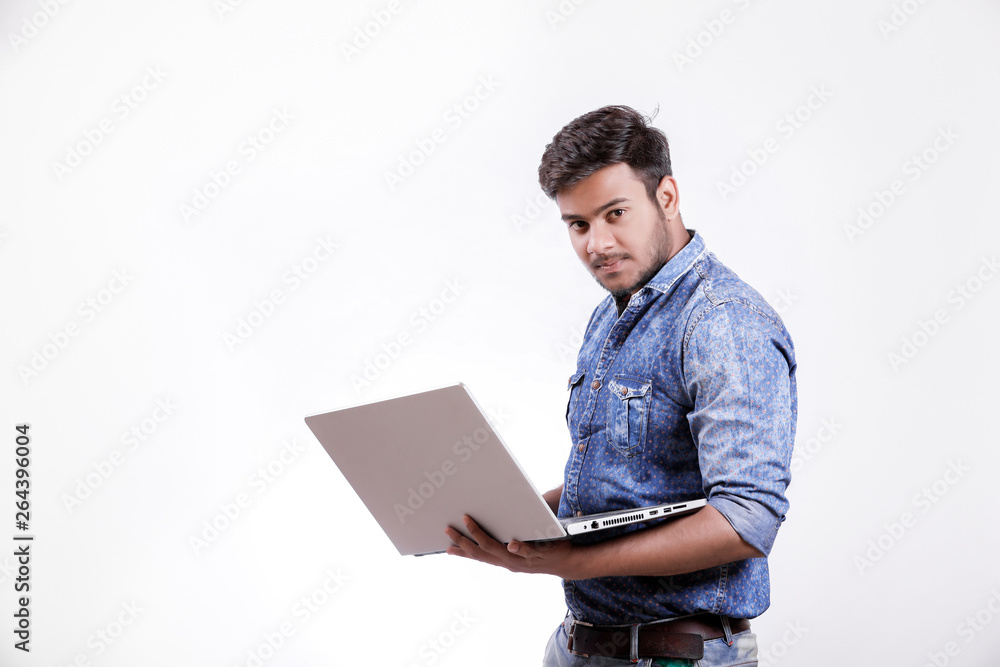 Young indian man with laptop Young indian man with laptop
