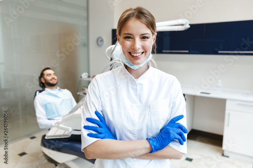 Happy young woman doctor in medical dentist center.