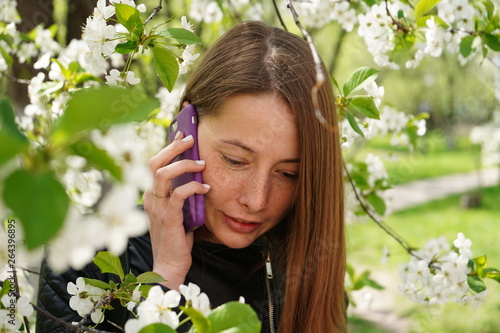 portrait of young woman in spring garden