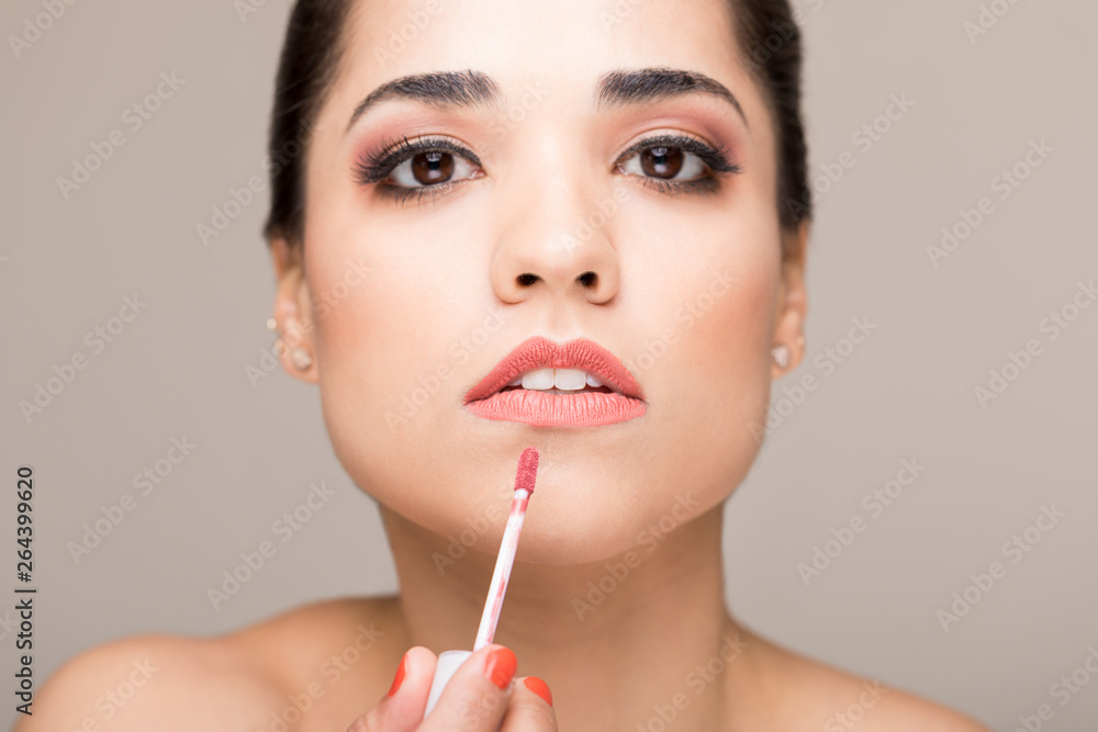 Attractive Model Applying Makeup On Lips Attractive Model Applying Makeup On Lips