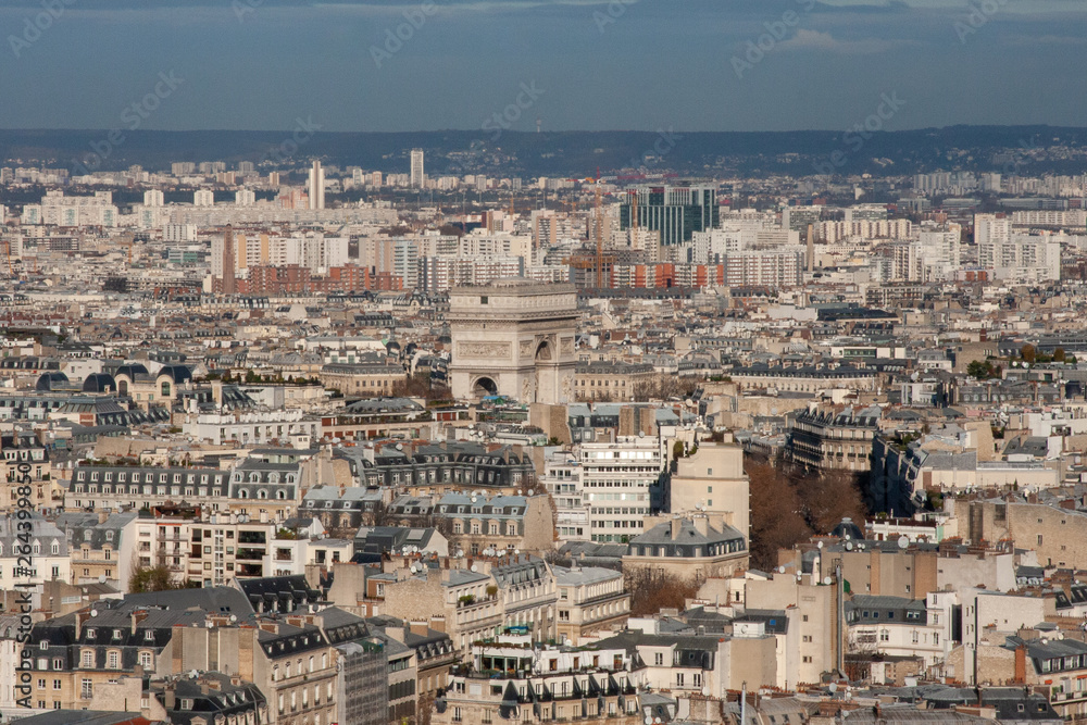An aerial view of the landscape of Paris from the Eiffel tower towards the Arc de Triomphe