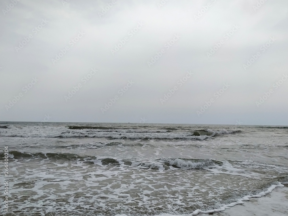Playa, arena, espuma del mar, en Isla Cristina provincia de Huelva España. Océano Atlántico Playa, arena, espuma del mar, en Isla Cristina provincia de Huelva España. Océano Atlántico