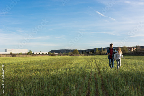 Children playing in a meadow.