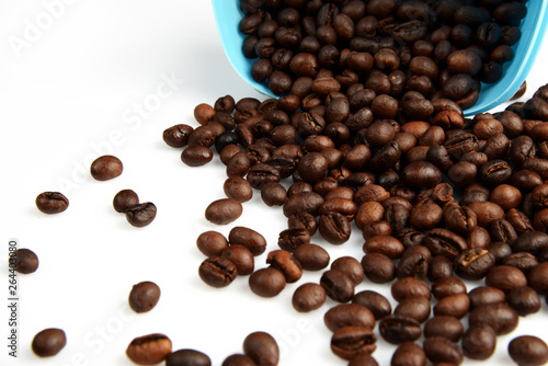 Roasted Coffee beans in a bowl on white background