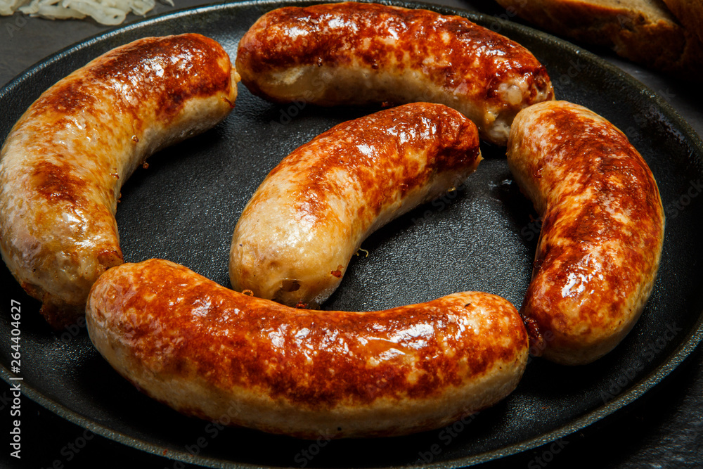 macro delicious ruddy meat wieners fried in large frying pan macro delicious ruddy meat wieners fried in large frying pan