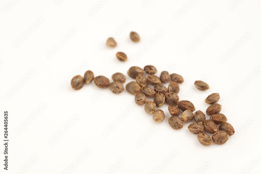 Naklejka premium Hemp seeds on white background macro