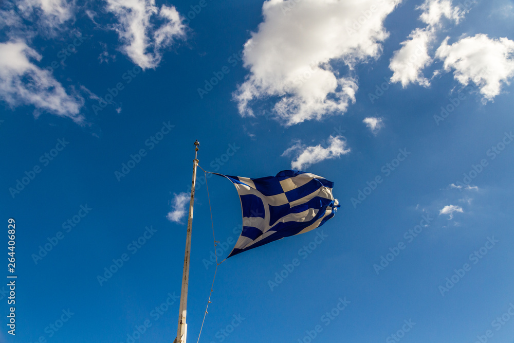 Greek flag against blue sky