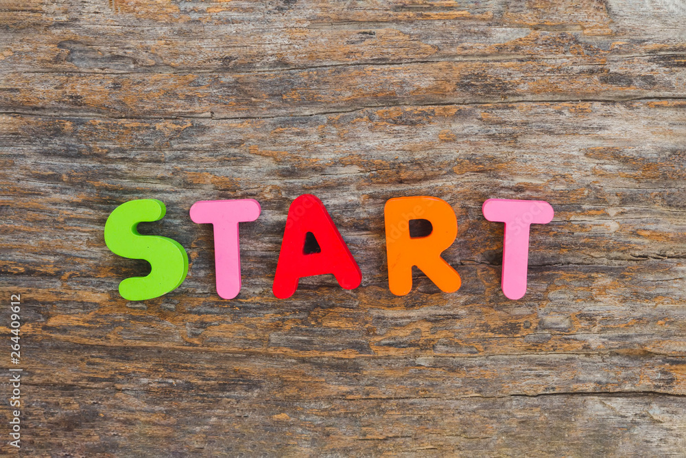 Fototapeta premium The wooden letter came in the word Start