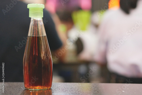 The bottle of fish sauce.