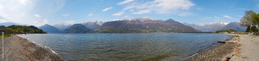 Lake Como, Italy - April 2019: panoramic view of the lake and the Italian Alps in the background.