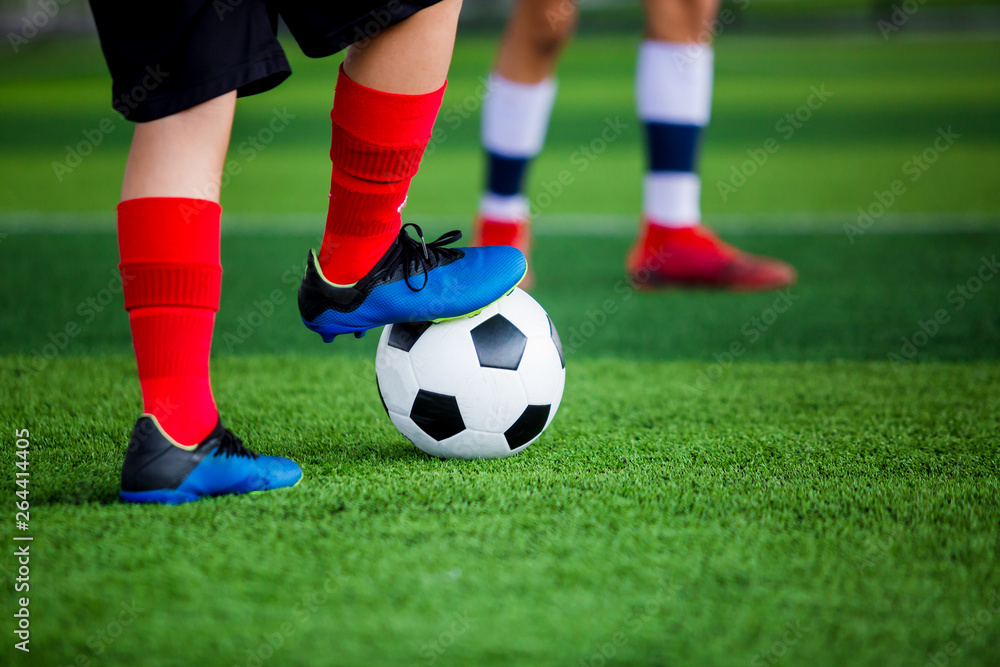 young boy soccer players run to trap and control the ball for shoot to goal