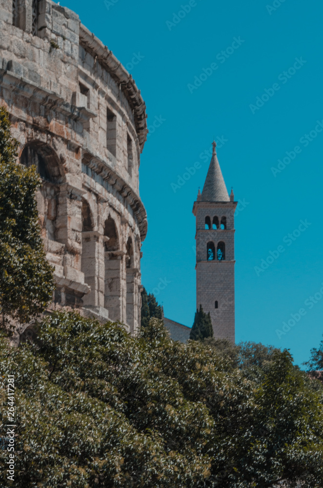 Fototapeta premium The tower of the St Anthony of Padua beside the ampitheatre in Pula