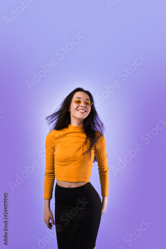 happy girl on simple background dancing