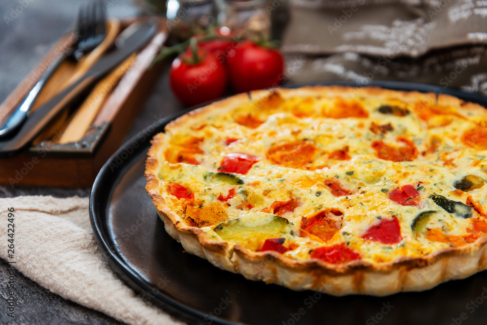 VEGETABLE PIE WITH CHERRY TOMATOES, GRILLED PEPPERS AND COURGETTES With fresh eggs and fresh cream