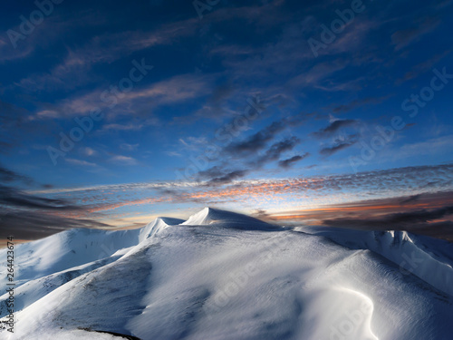 Day to night pastels transition in winter mountains