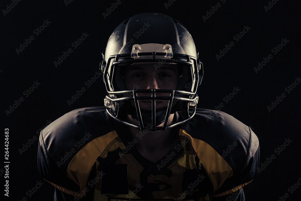 American football player isolated on black background 