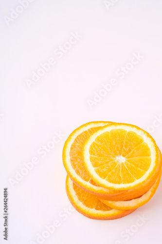 Tower of Orange slices fruit on white background