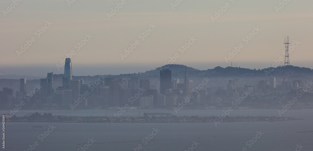 The northern California city of San Francisco skyline is seen through poor air quality at dusk.