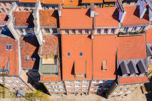 Warsaw, Poland red orange roof in old town market square with historic street town architecture and windows rooftop closeup pattern