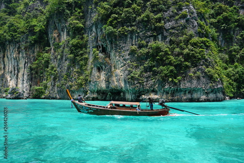 longtail boat cruise in thailand phi phi island crystal clear blue water