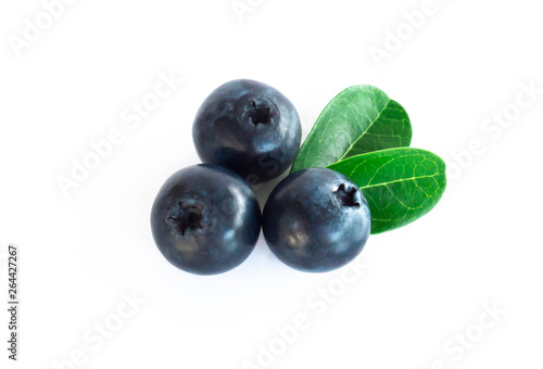 Fresh blueberries with green leaves isolated on white background