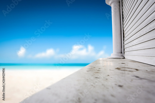 Desk of free space and summer beach background. 