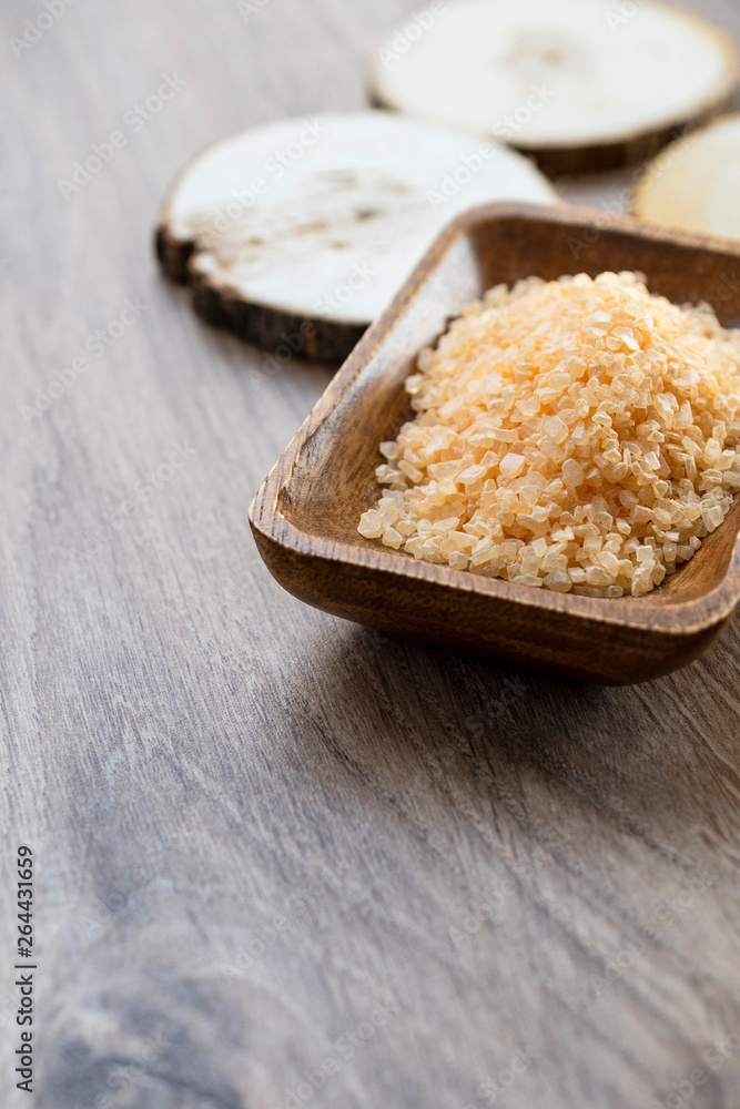 Spa sea salt in wooden bowl closeup Spa sea salt in wooden bowl closeup