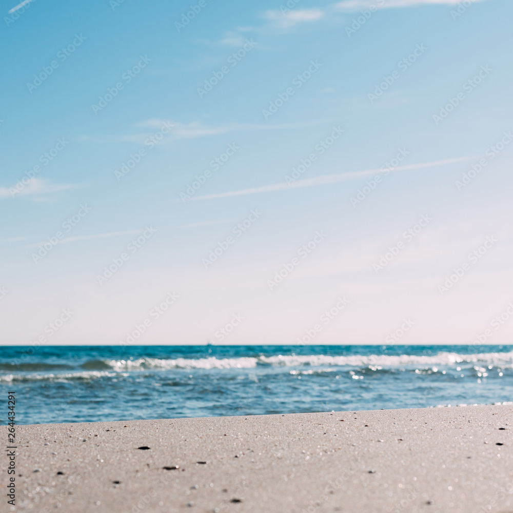 Summer sand beach and seashore waves background